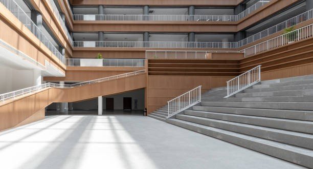 The sun shines on the open corridor of the library